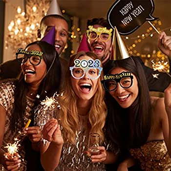 Happy New Year 2023 party hats and noisemakers